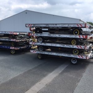 Seven stacked container dollies
